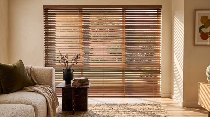 Wooden venetian blind with 50mm walnut slats in a lounge